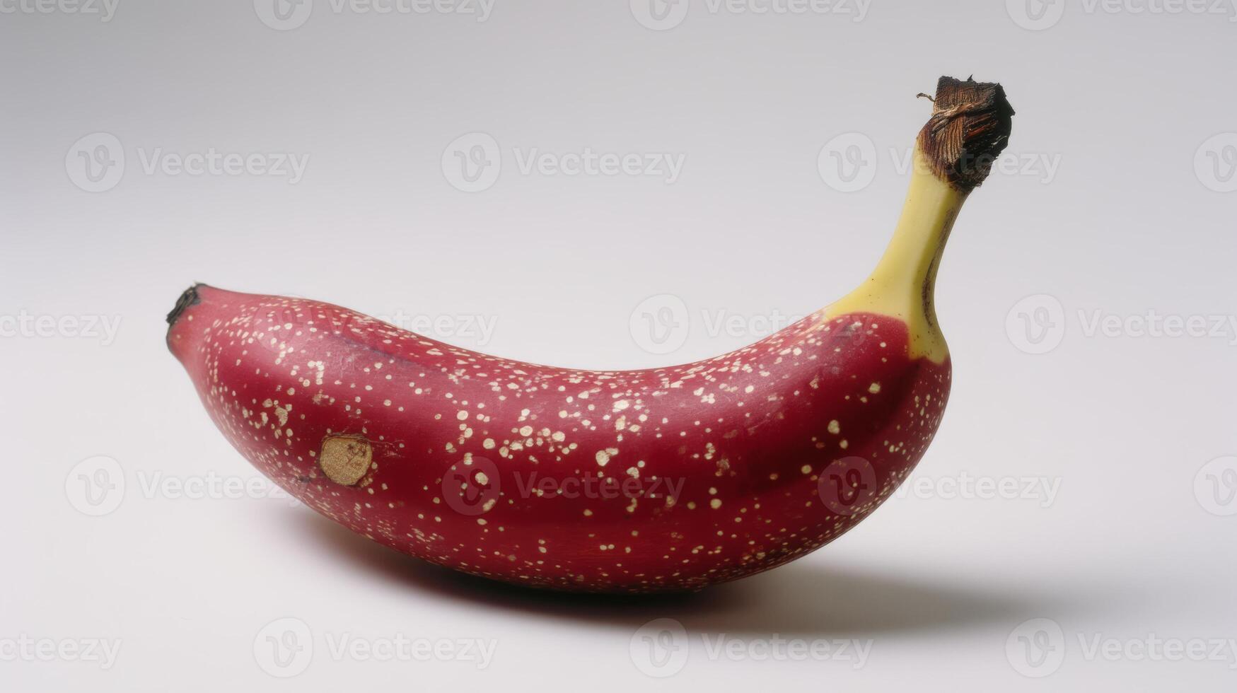 Ripe Red Banana with Speckles Isolated on White Background photo