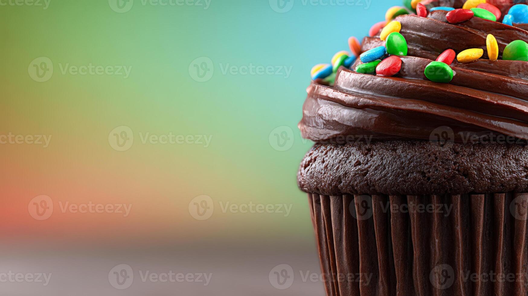 Closeup of Chocolate Cupcake with Sprinkles and Swirled Frosting photo