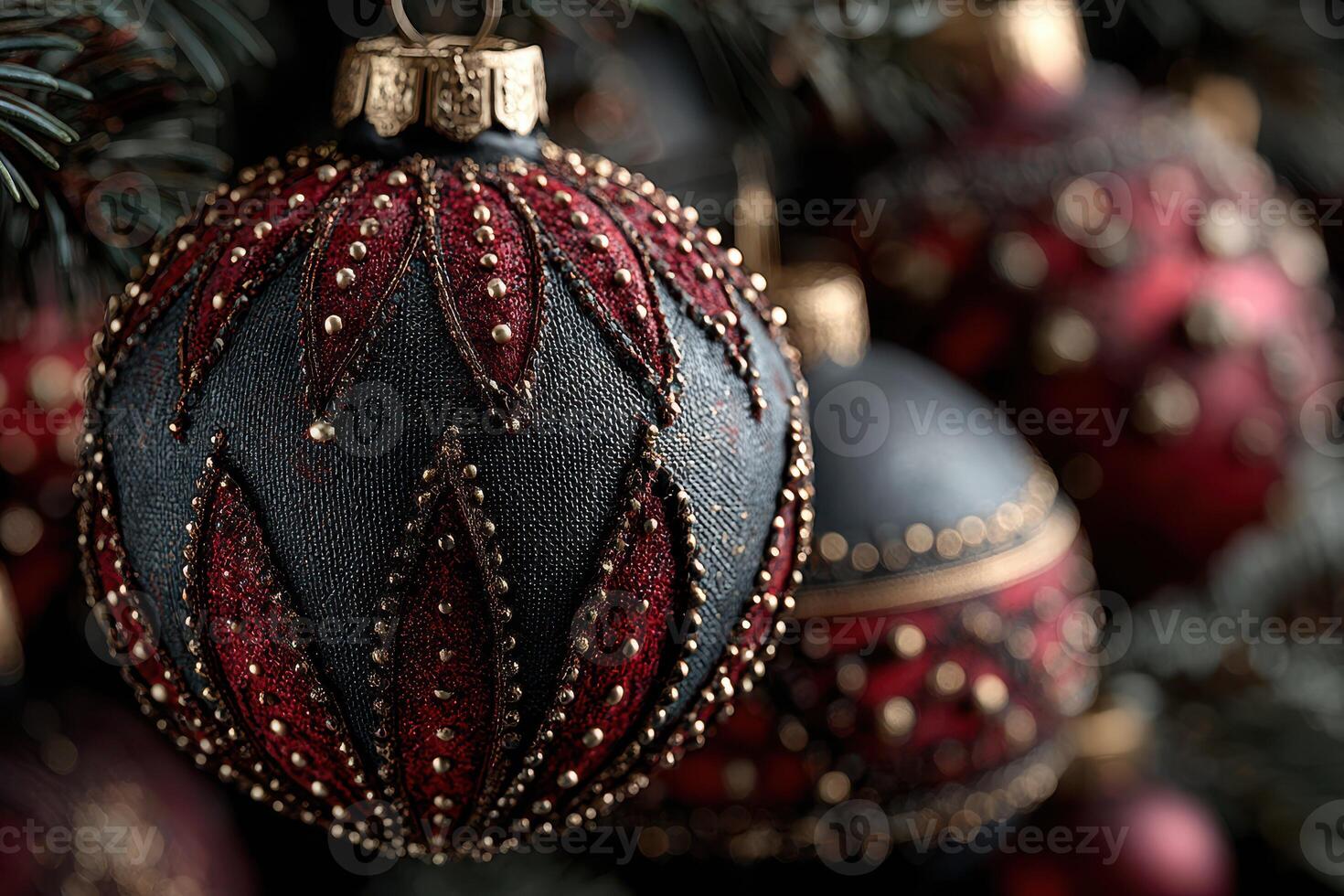 Beautifully crafted Christmas ornaments in rich colors hang from a festive tree during the holiday season photo