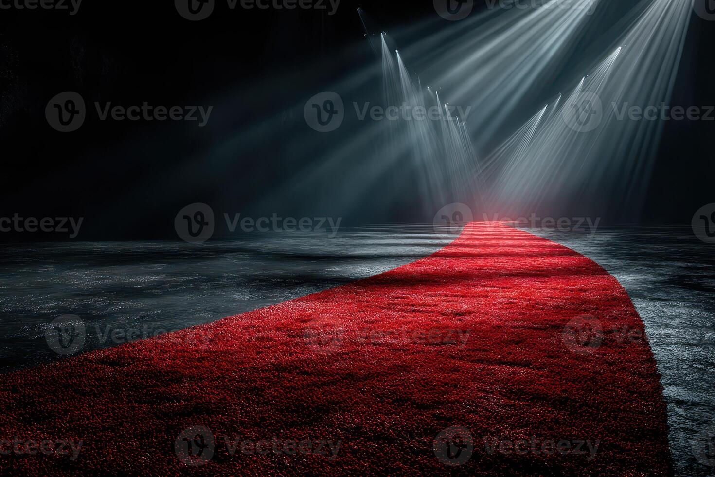Red carpet leading to a spotlighted entrance in a dark venue creating an elegant and dramatic atmosphere photo