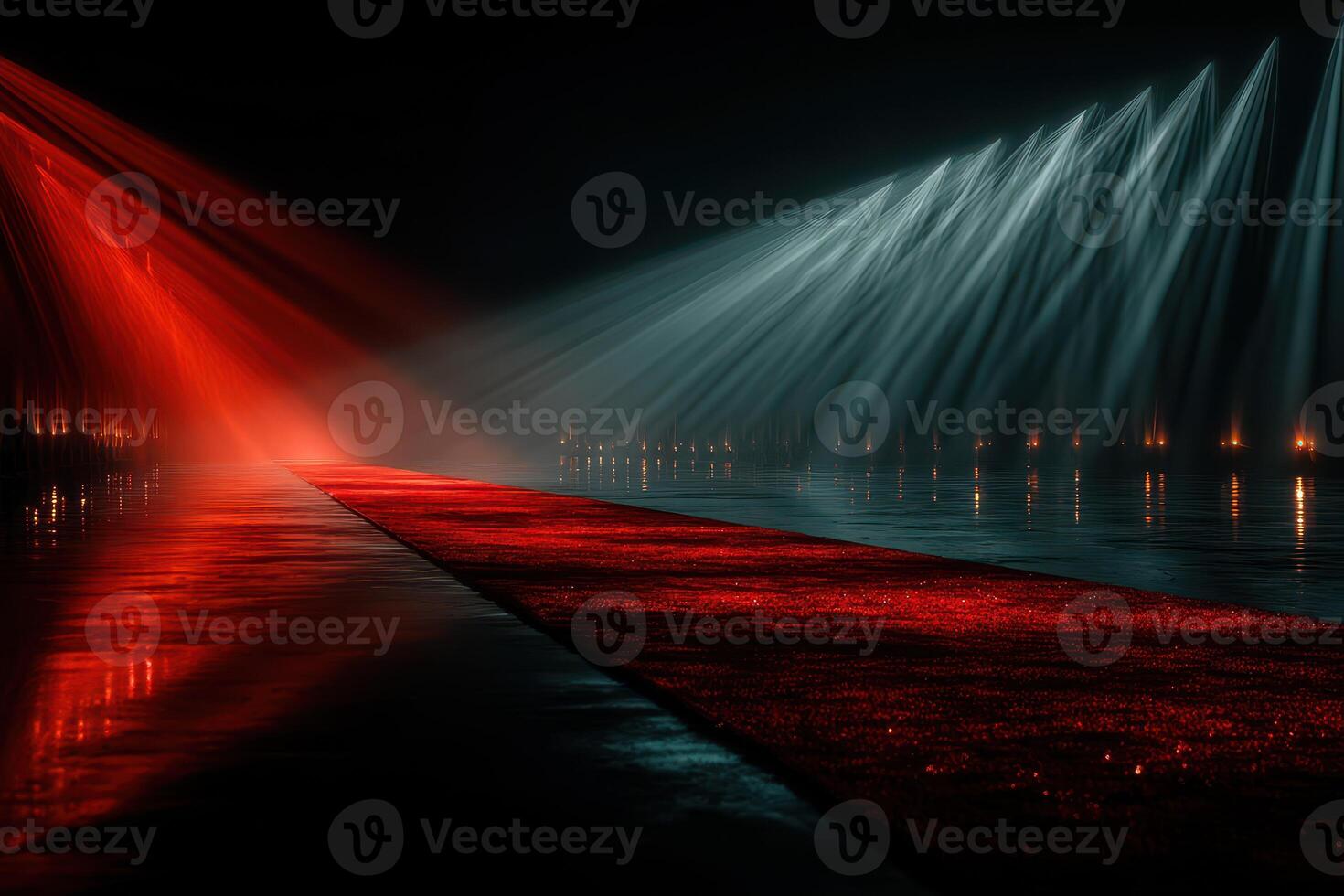 Dramatic water light show featuring vibrant red and blue hues at night near the water's edge photo