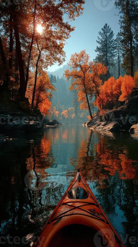 Kayaking through vibrant autumn trees by the calm river in the early morning light photo