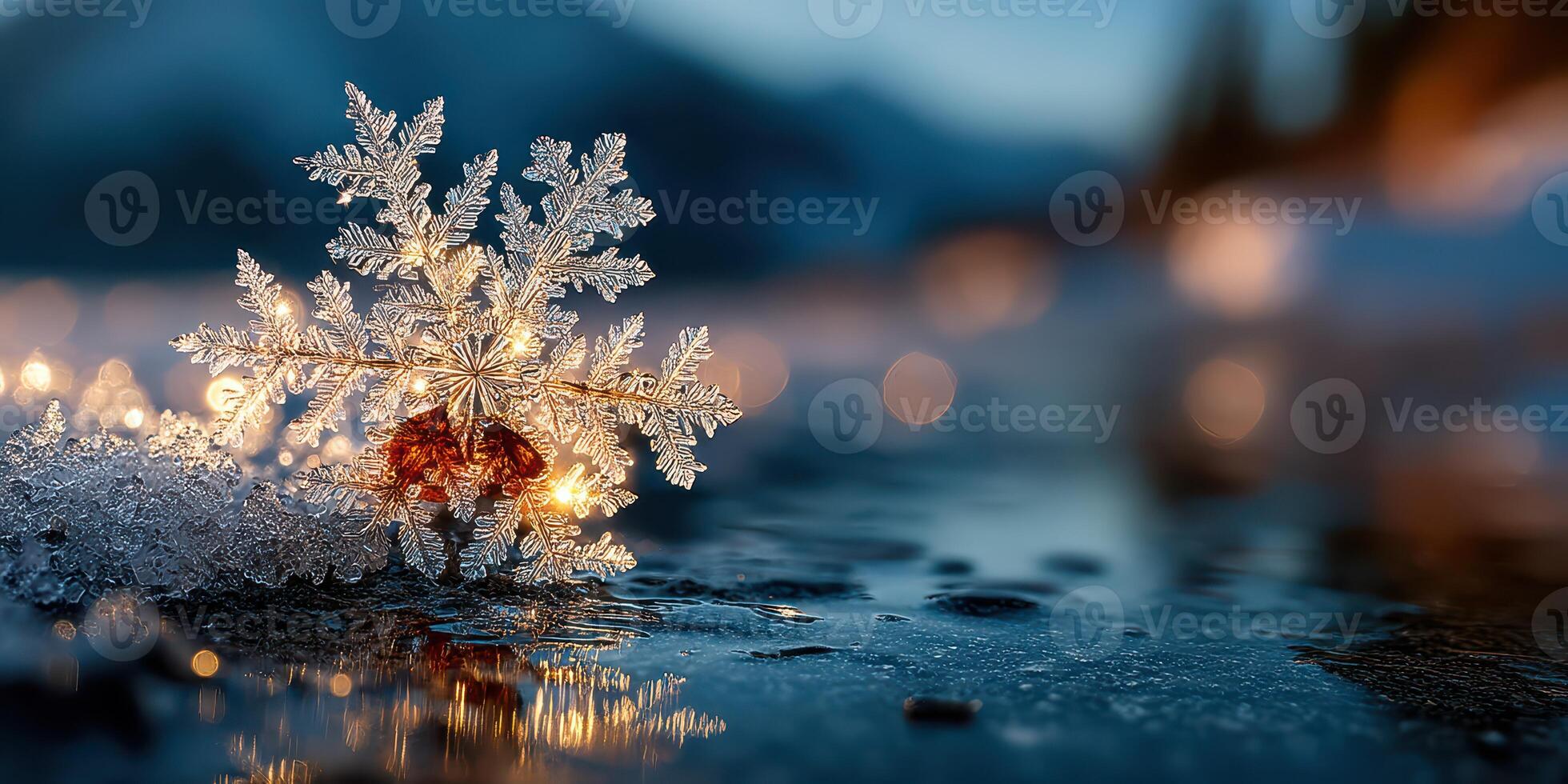 Beautiful snowflake resting on a reflective surface during twilight with twinkling lights in the background photo