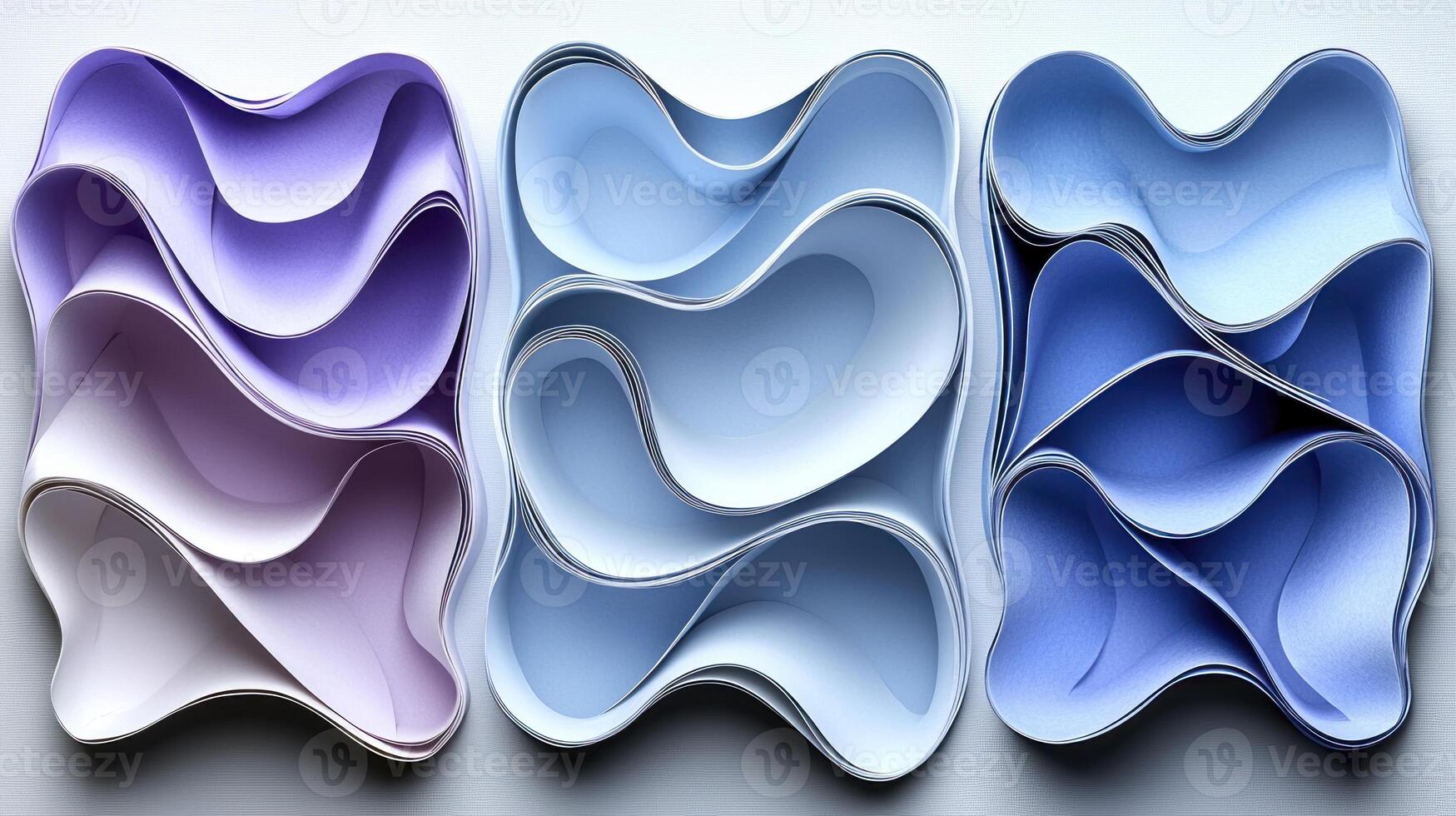 Three different colored paper shapes arranged in a row photo