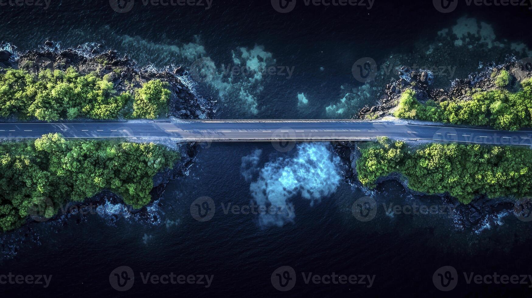 An aerial view of a road over a body of water photo