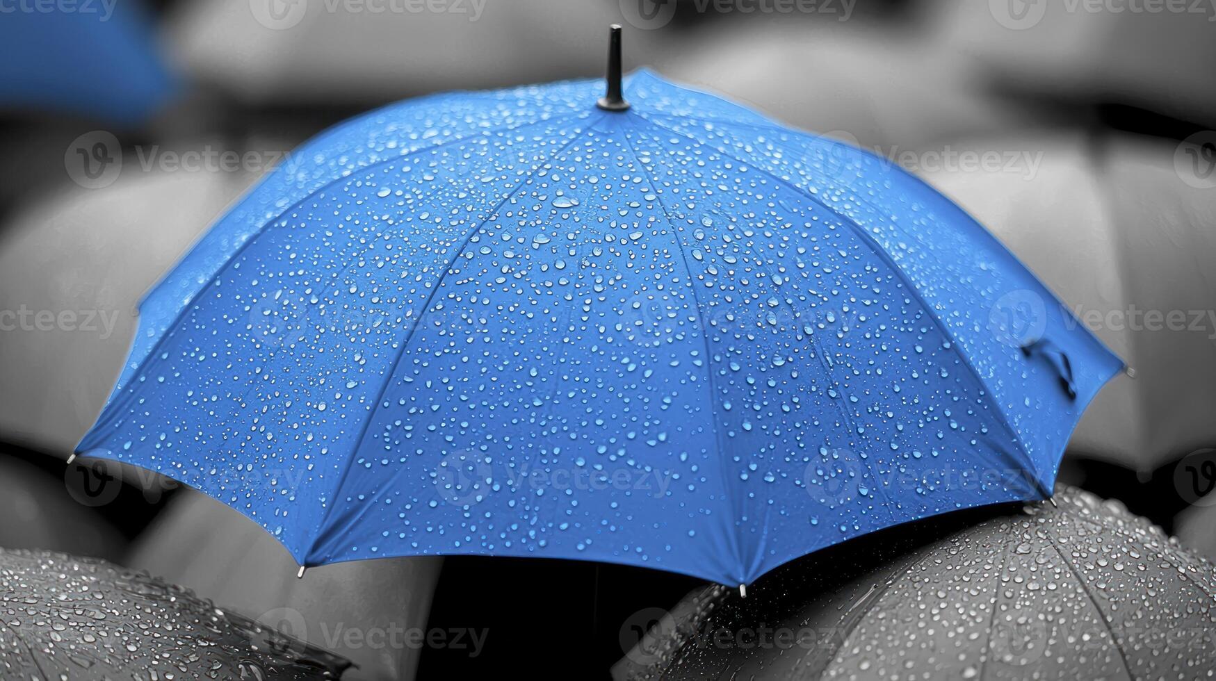 A blue umbrella with water droplets photo
