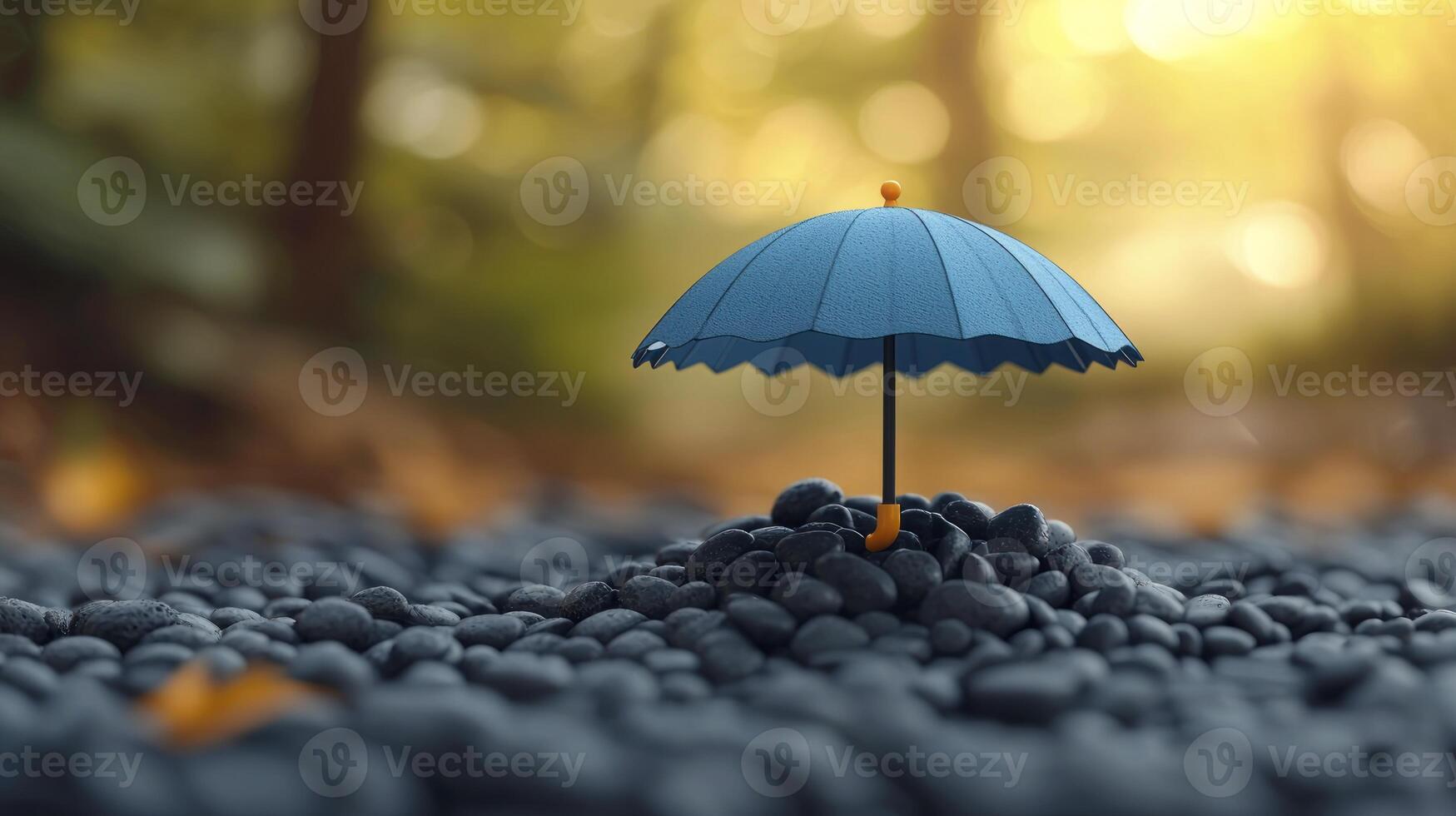 A blue umbrella is sitting on top of a pile of rocks photo