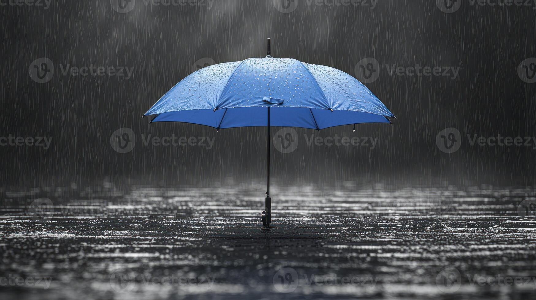 A blue umbrella in the rain photo