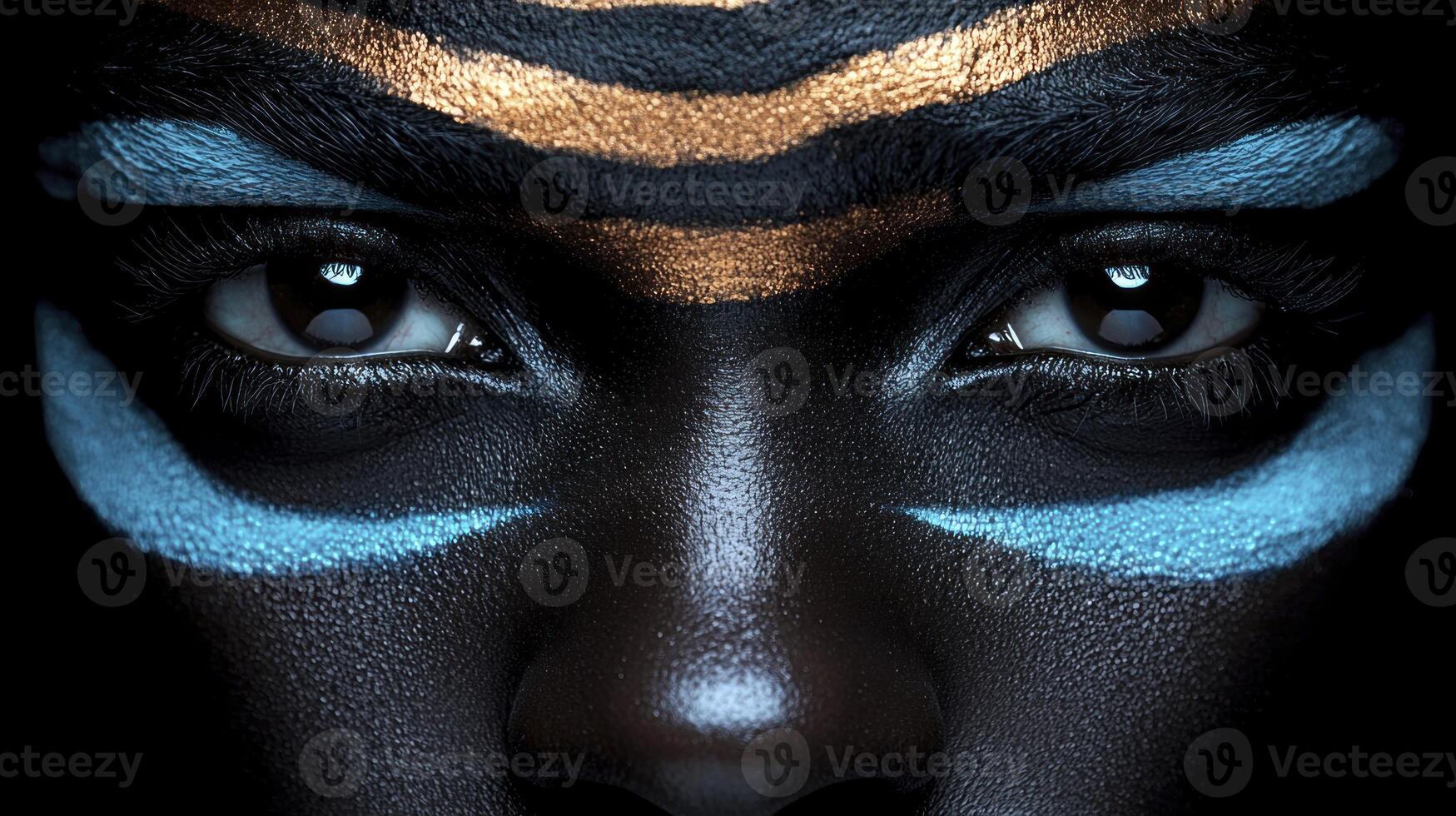 A woman with painted face and blue eyes photo