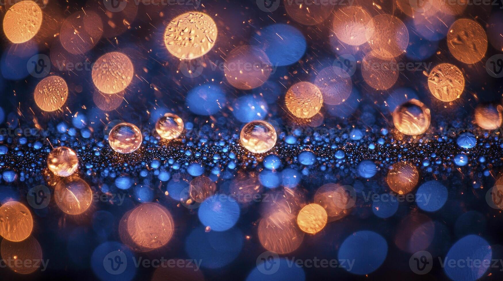 Water droplets on a blue background with orange lights photo