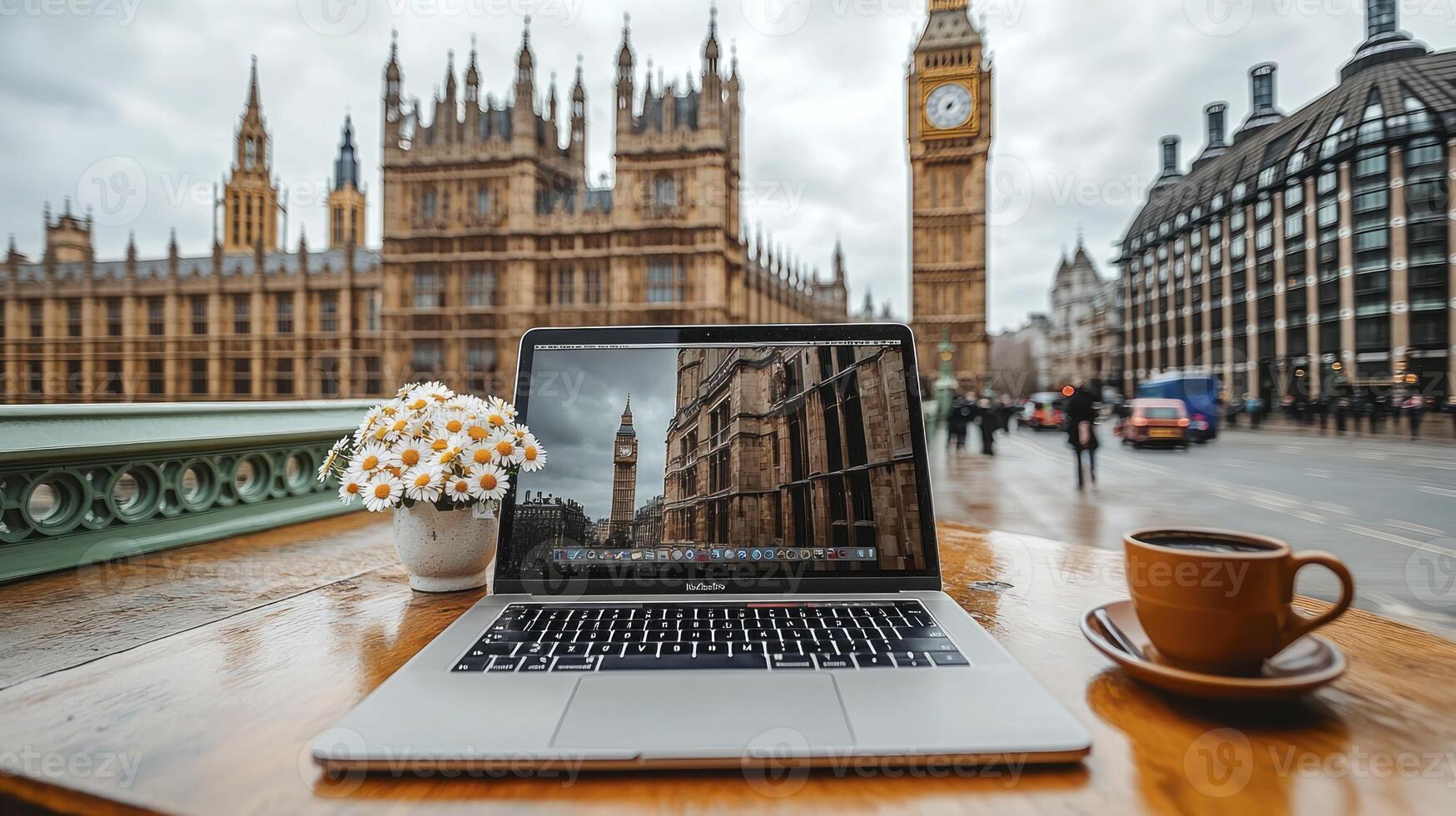 Laptop and coffee on table in front of big ben photo