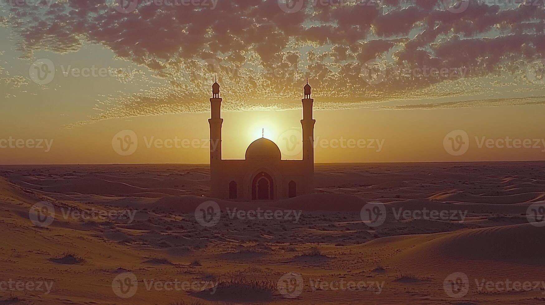 A mosque in the desert at sunset photo