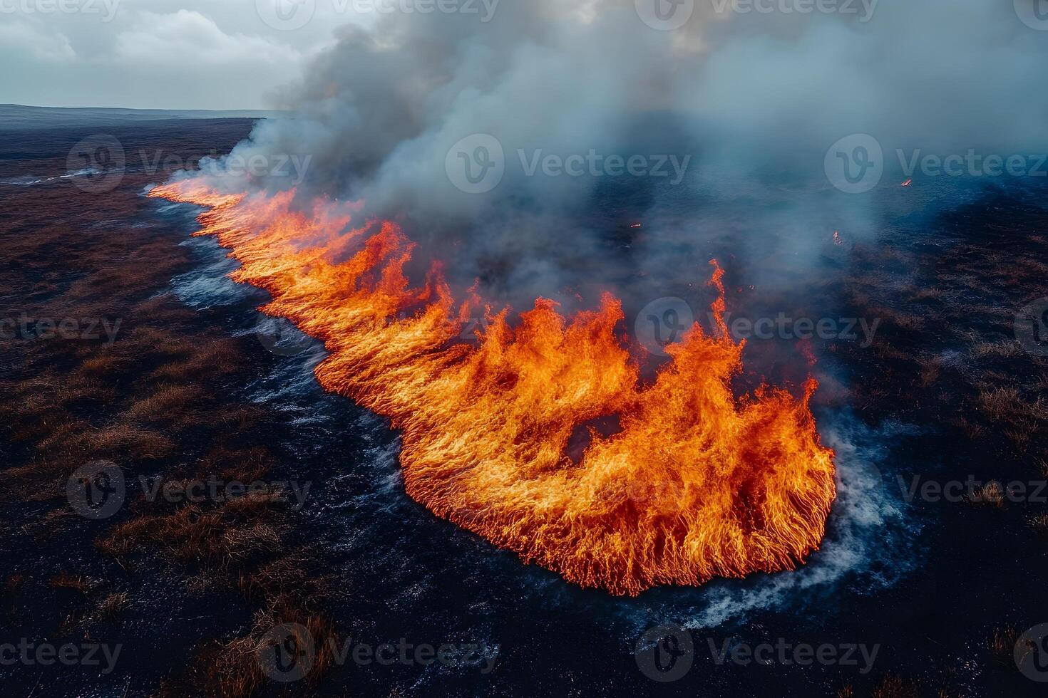 Intense Wildfire Spreading Across Dry Grasslands in Remote Countryside photo