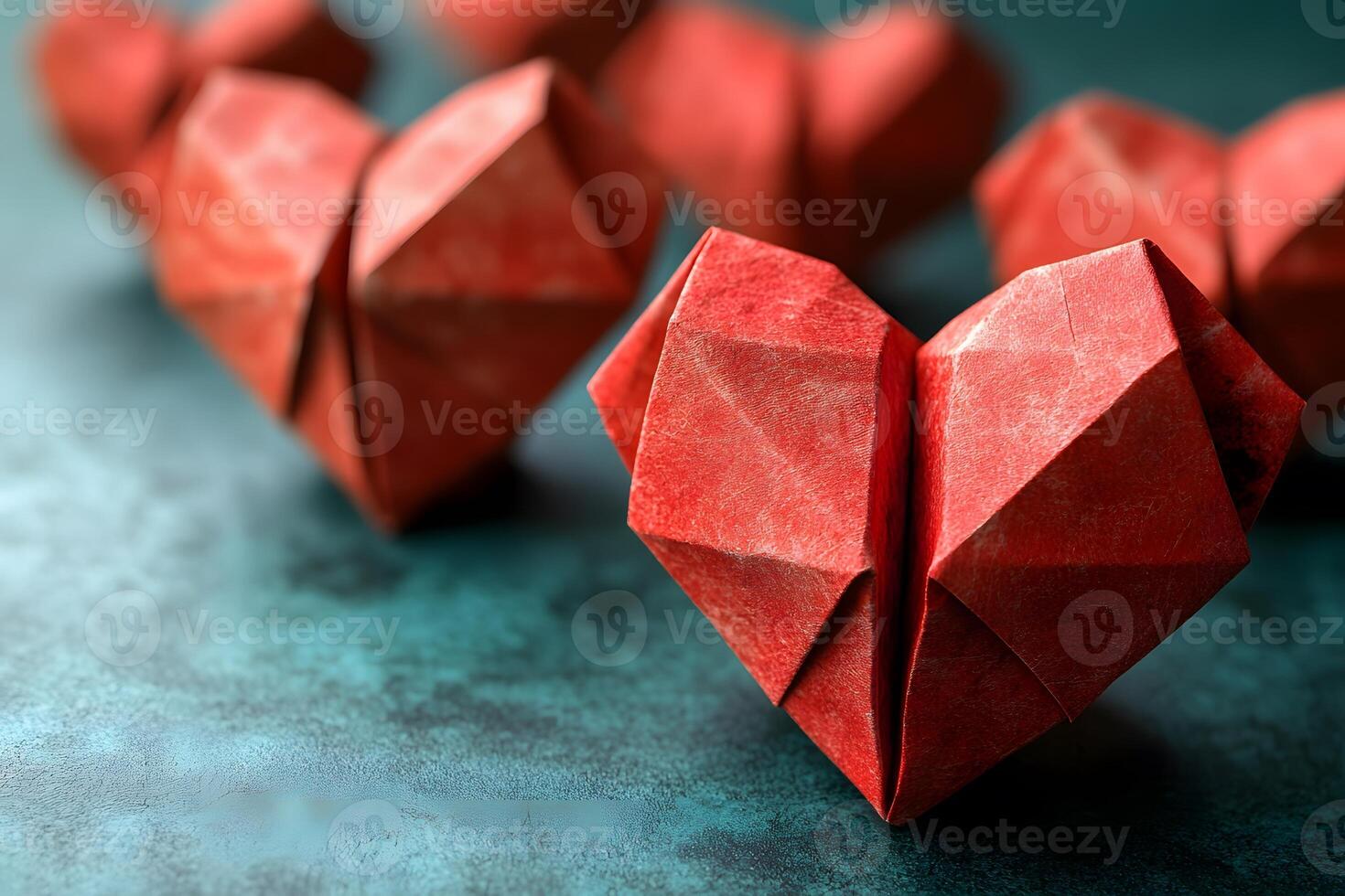Origami Red Heart Shapes on Turquoise Surface Valentine's Day Craft and Design Inspiration photo