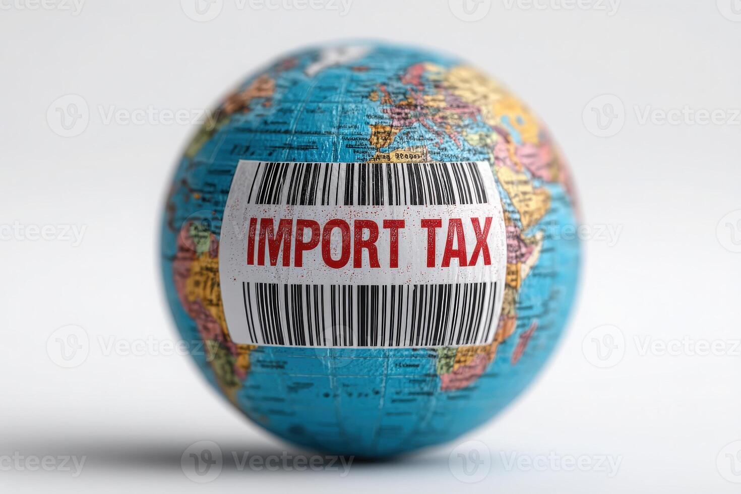 A small globe with a barcode that reads import tax affixed to its surface represents the financial implications of international trade. The visual emphasizes global economic activity. photo