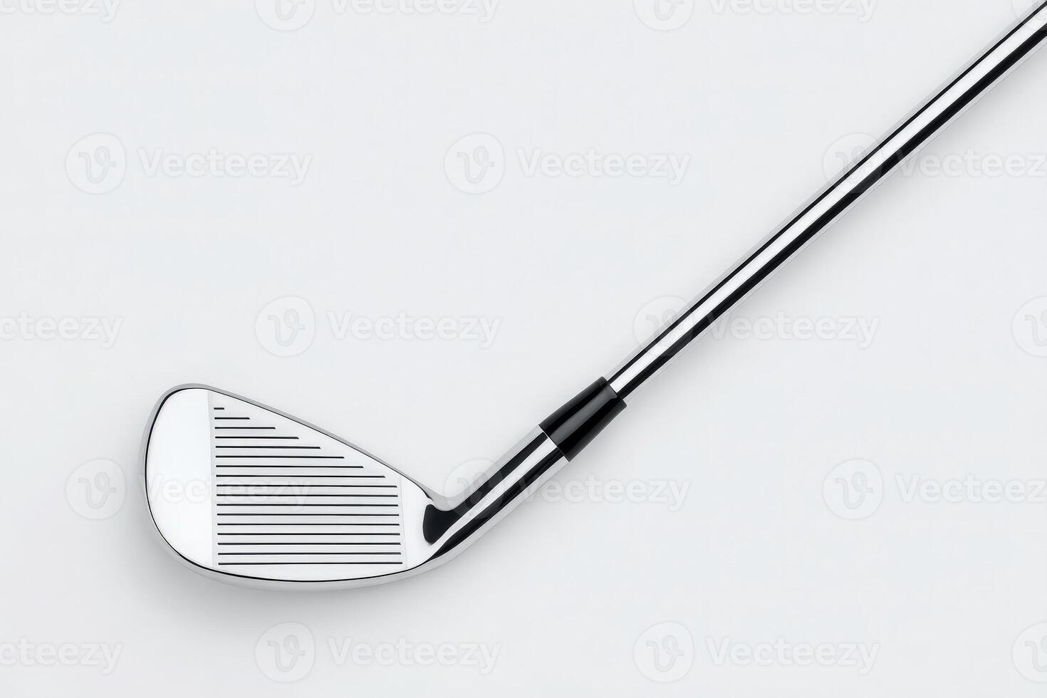 Close-up view of a golf club featuring a polished chrome surface and detailed grooves on the clubface, emphasizing its craftsmanship and suitability for gameplay during a clear day on the course. photo