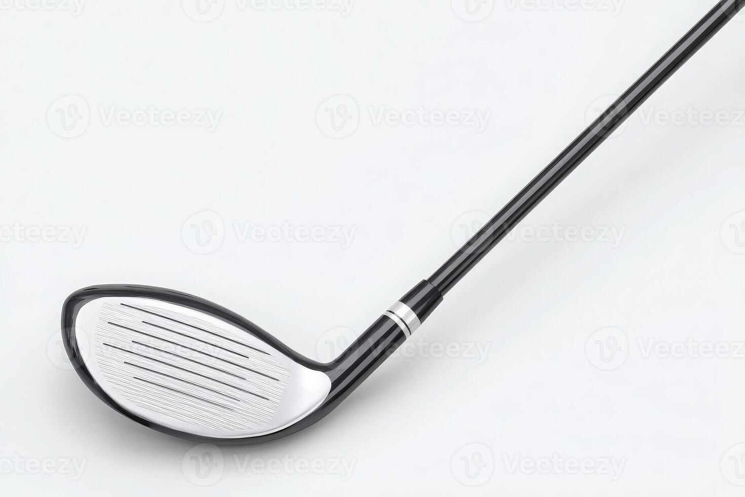 Close-up view of a golf club head, showcasing its sleek design. The shiny surface contrasts with the black color of the shaft, emphasizing the grooves for improved performance during play. photo