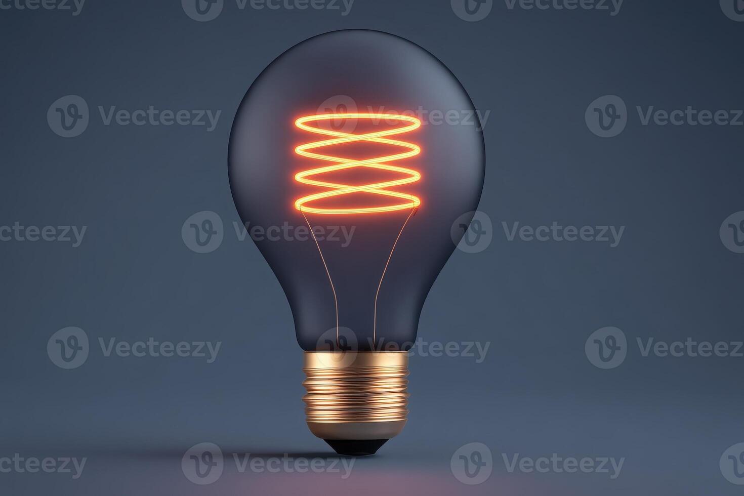 A glowing light bulb features a spiral filament that emits warm orange light. photo
