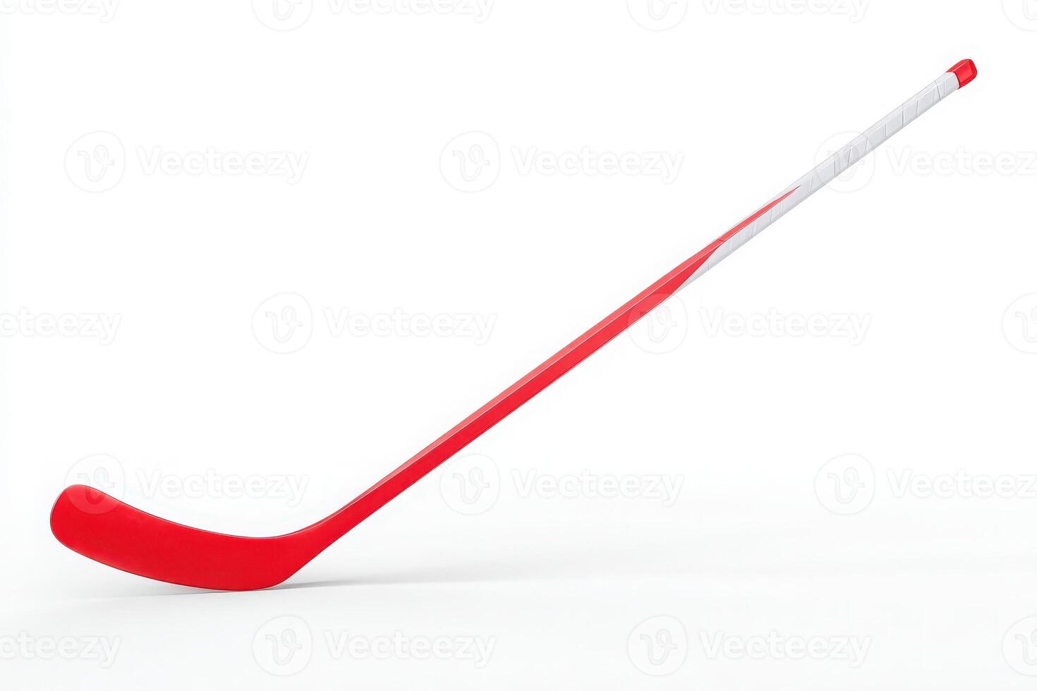 A bright red hockey stick is positioned at an angle against a stark white background. The stick showcases a sleek design, highlighting its curved blade. photo