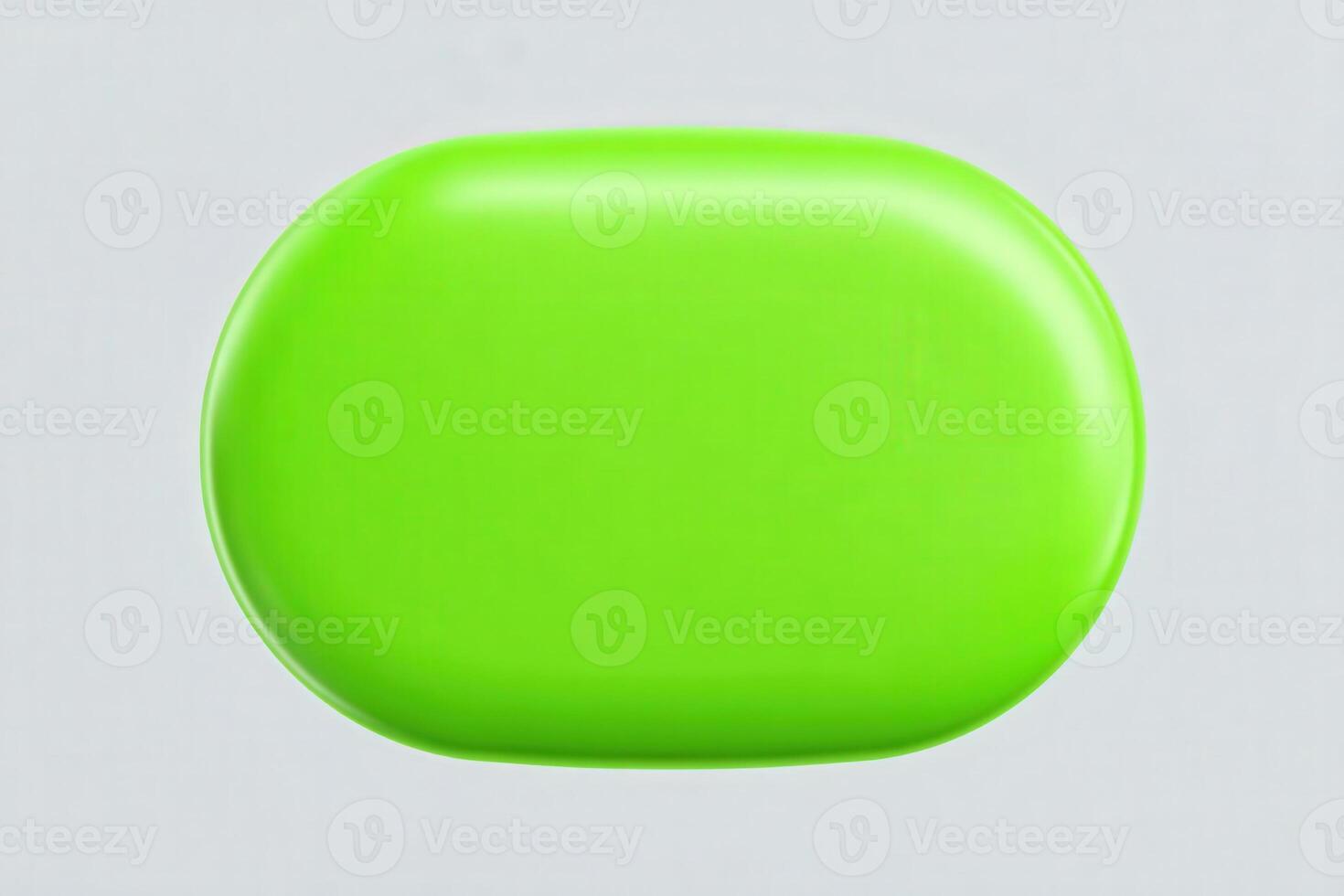 A bright green oval soap sits on a light grey background. It exhibits a glossy surface that reflects light, showcasing its vibrant color and smooth texture. photo