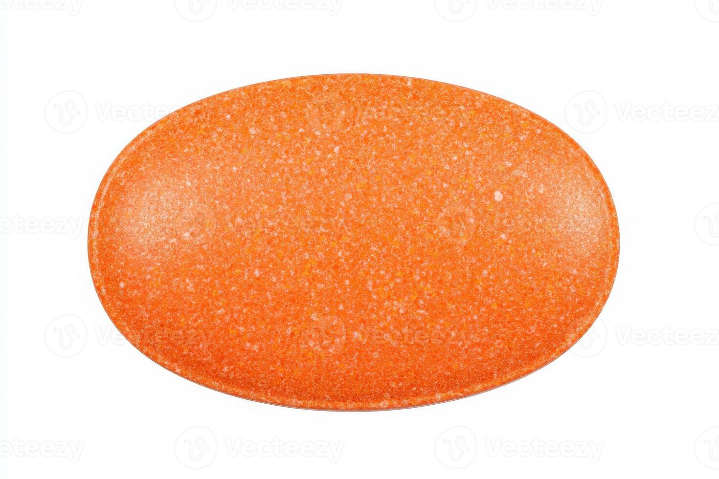 A smooth, bright orange tablet is centered on a white background. Its oval shape and glossy surface catch the light, highlighting its uniform color and texture. photo