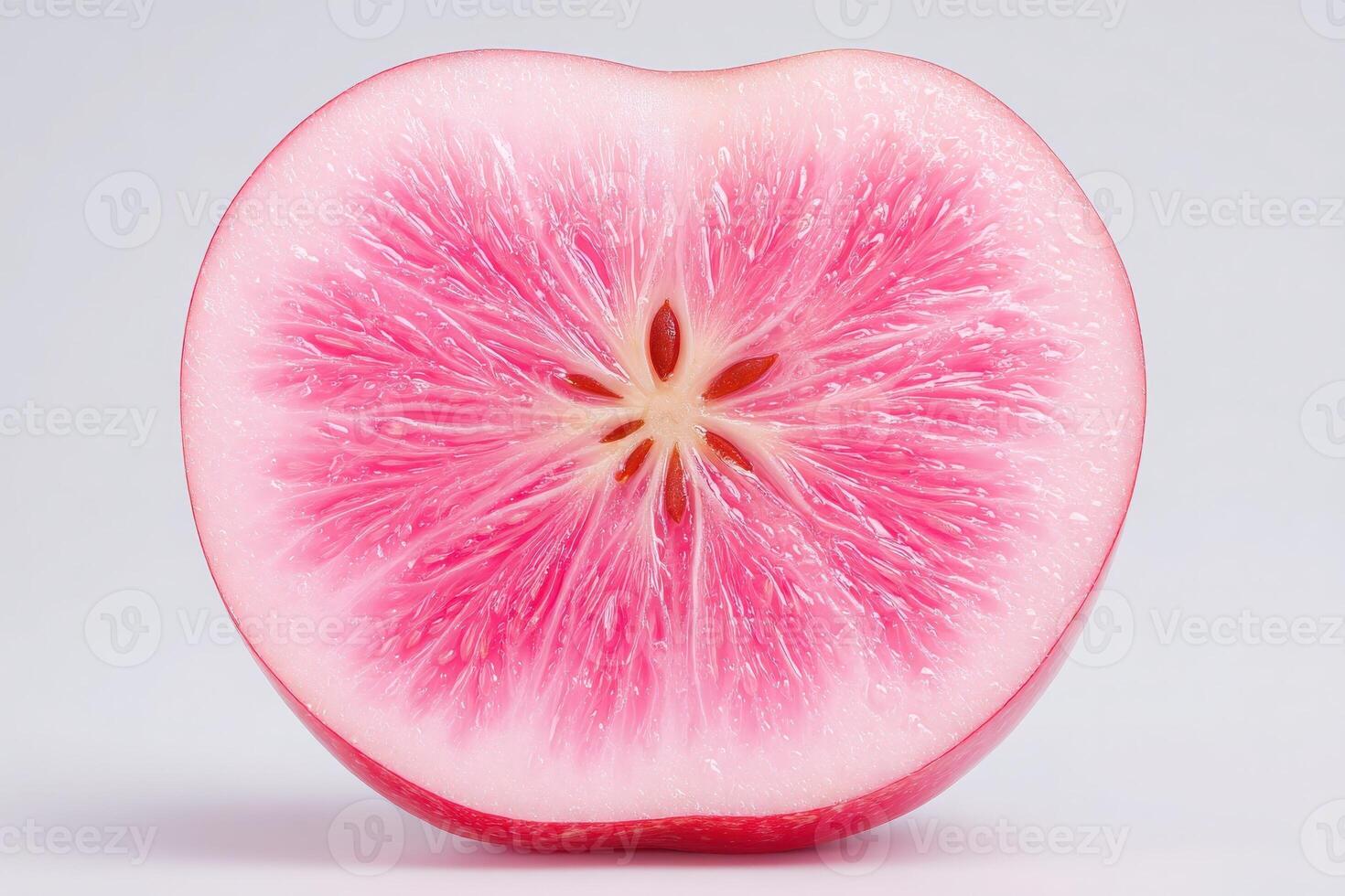 The vividly pink cross-section of a watermelon radish reveals detailed, natural patterns and a glossy surface. This striking vegetable is sliced to showcase its unique features and color contrast. photo