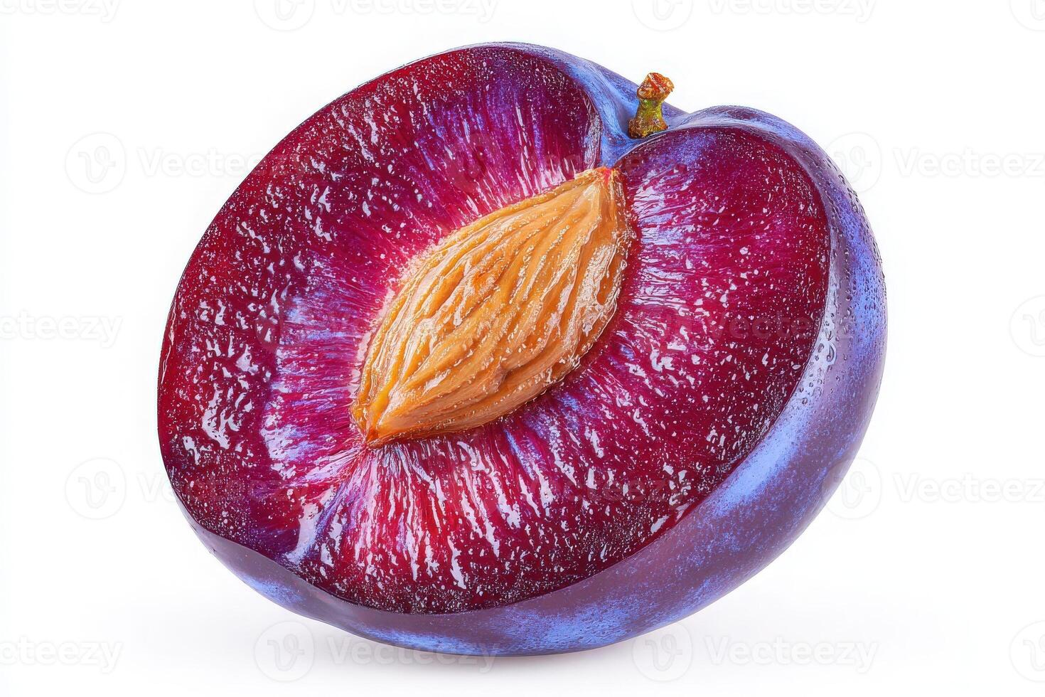 A ripe plum is cut in half, revealing its vibrant purple skin and juicy, golden flesh. The seed is prominently visible in the center, highlighting its natural allure and freshness. photo