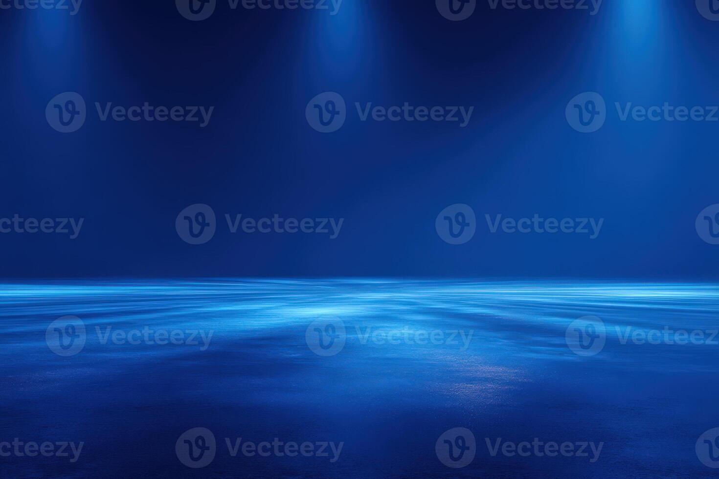Dark blue background featuring smooth, reflective surface illuminated by bright spotlights. The lighting creates a dramatic and mysterious ambiance, suitable for performances or events at night. photo
