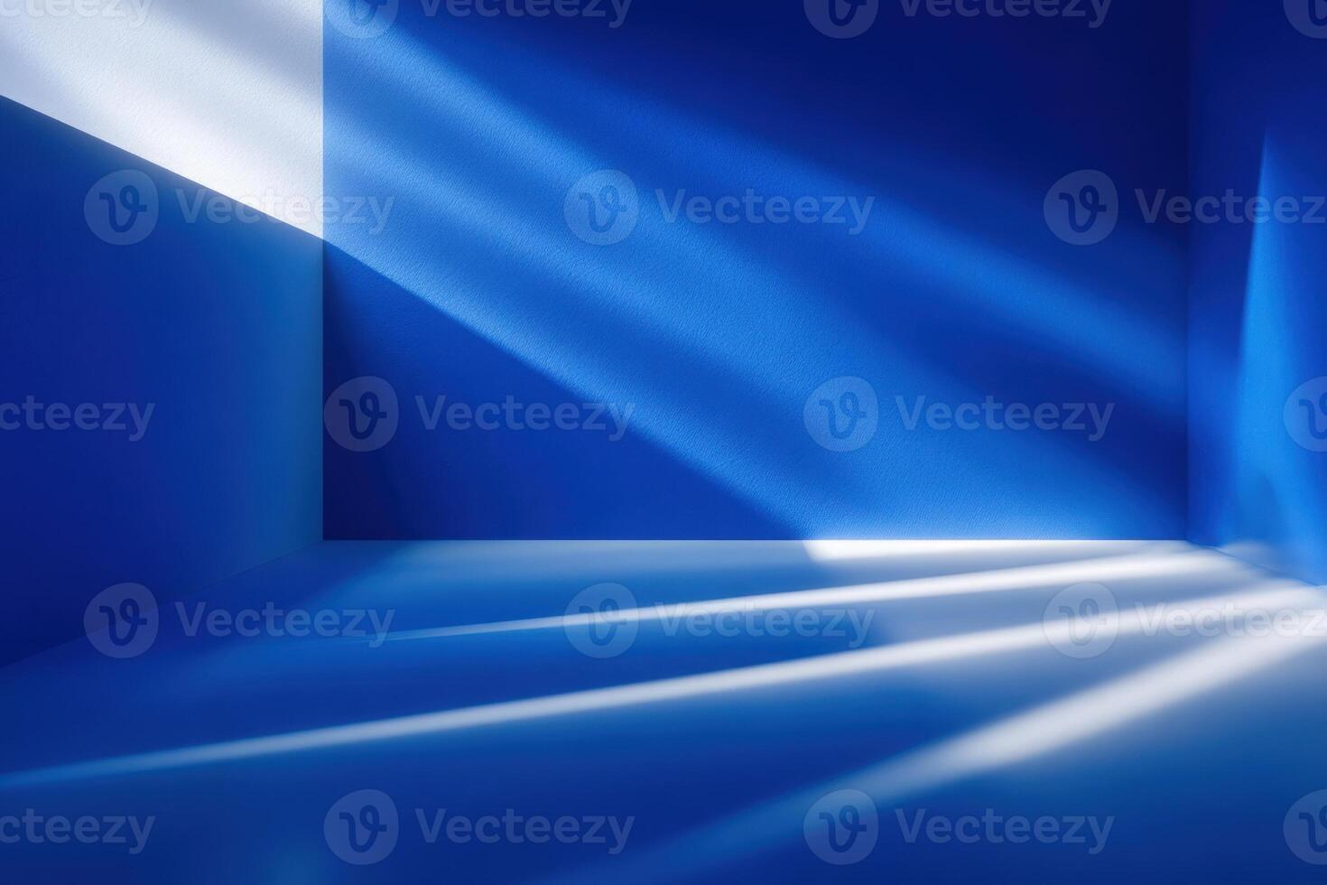 Bright blue walls create an abstract space filled with angled shadows and light patterns. The interplay of light emphasizes the minimalist design and enhances the vibrant atmosphere. photo