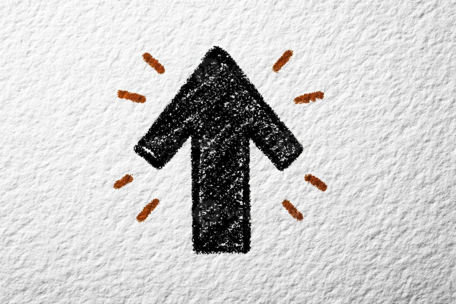 A bold upward arrow is drawn in black against a textured white background, surrounded by energetic orange accents. The design conveys a sense of direction and positivity. photo