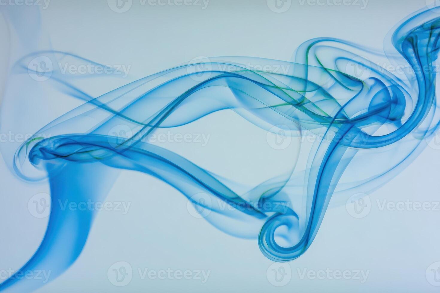 Soft blue smoke swirls and twists in abstract forms, creating a mesmerizing visual against a light backdrop. The intricate patterns suggest a tranquil and ethereal atmosphere. photo