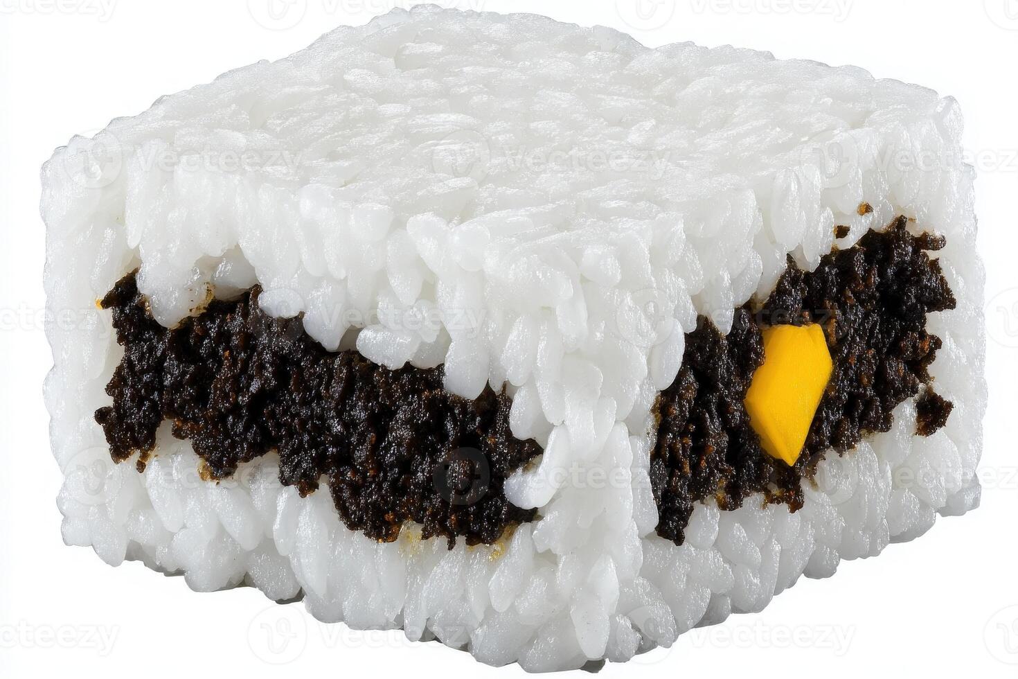 A creative rice dish features white sticky rice formed into a rectangular block, filled with black seaweed paste and a small yellow ingredient peeking through. photo