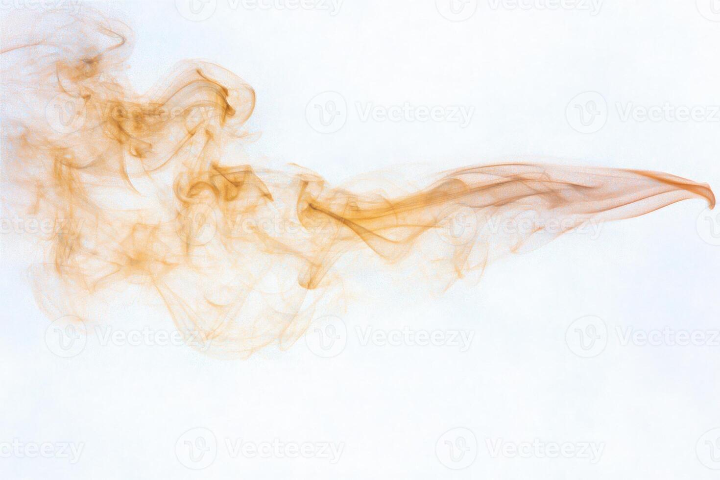 Amber smoke gracefully swirls across a bright background, forming abstract shapes and delicate trails. The ethereal quality and fluid motion evoke a sense of mystery and creativity. photo