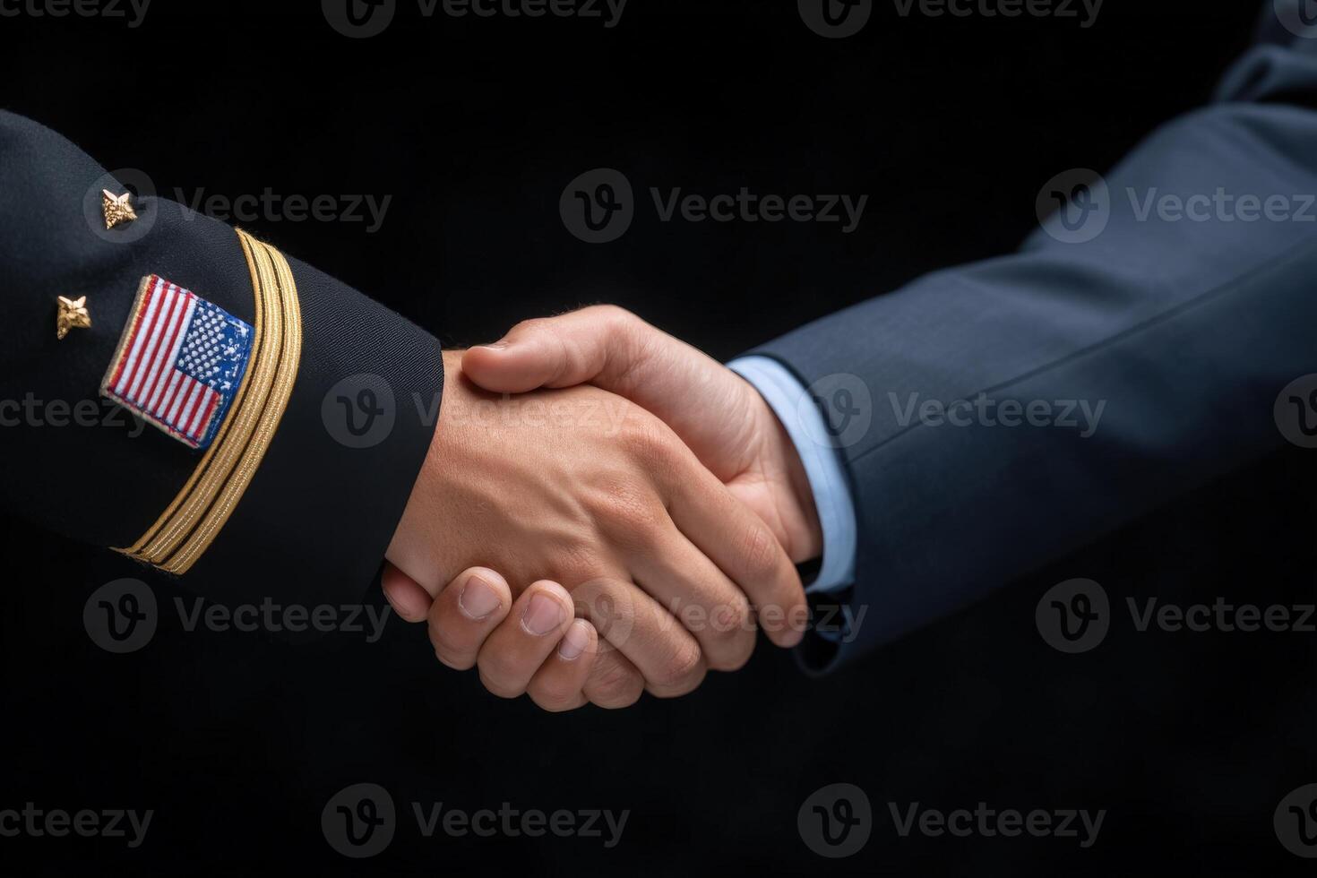 Two individuals engage in a firm handshake, symbolizing cooperation and mutual respect. One is dressed in military attire with a flag insignia, while the other is in formal civilian clothing. photo