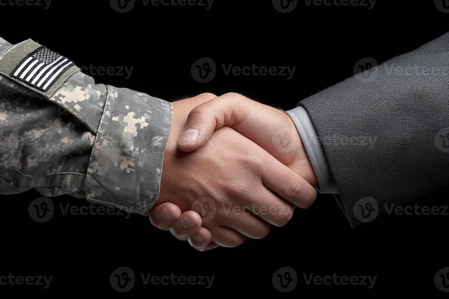 A soldier in camouflage uniform shakes hands with a civilian in a gray suit, representing collaboration and mutual respect. The dark background emphasizes the connection between them. photo