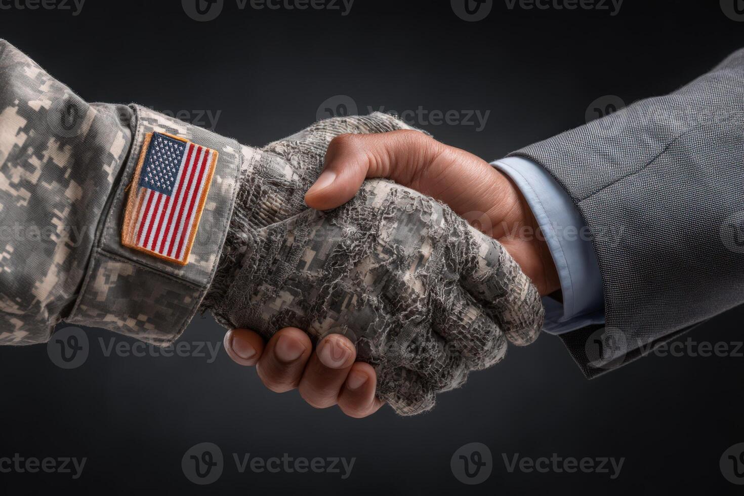 A soldier in a camouflage uniform shakes hands with a man in a business suit, representing partnership and mutual respect. The contrasting attire highlights different backgrounds yet shared goals. photo