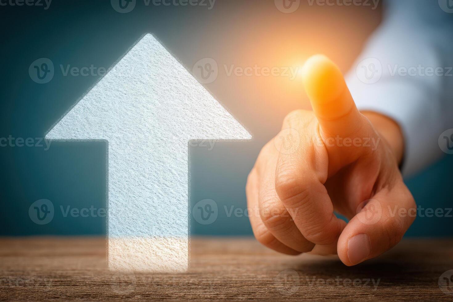A hand reaches toward a glowing upward arrow, signifying aspiration and improvement. The background is softly lit, enhancing the motivational theme during a business context. photo