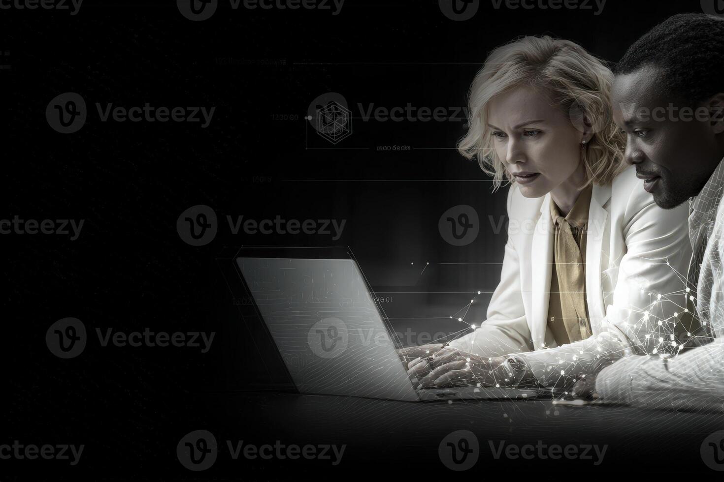 Two professionals are focused on a laptop, analyzing data together in a sleek, modern workspace. Their expressions show concentration and teamwork in a digital environment. photo