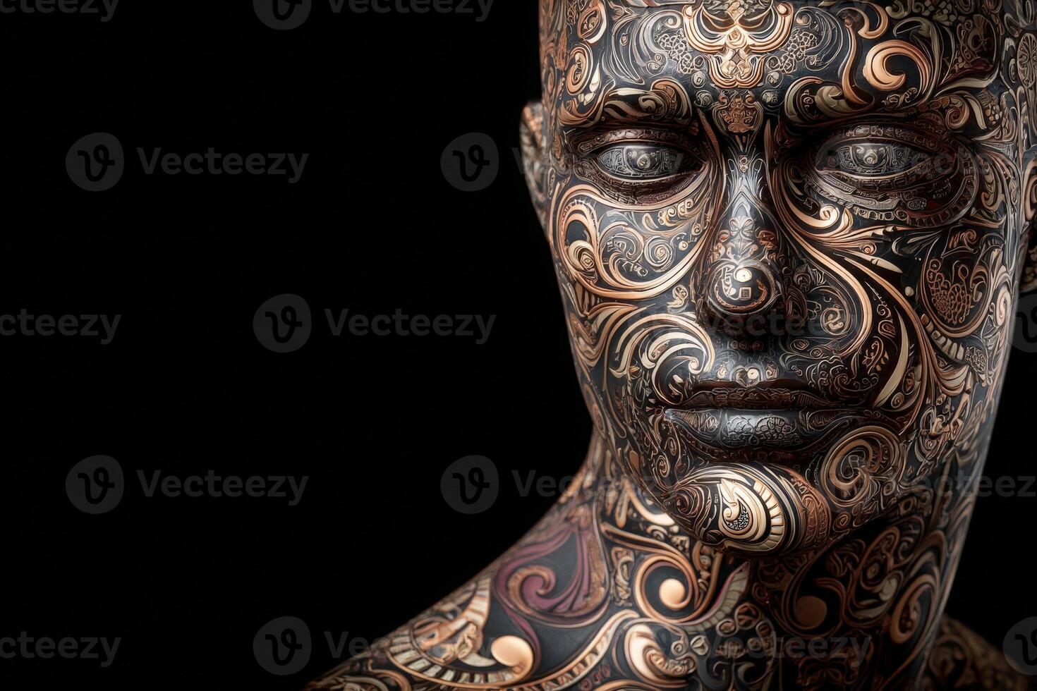 A beautifully crafted human sculpture adorned with elaborate patterns and swirling designs stands out against a black background. photo