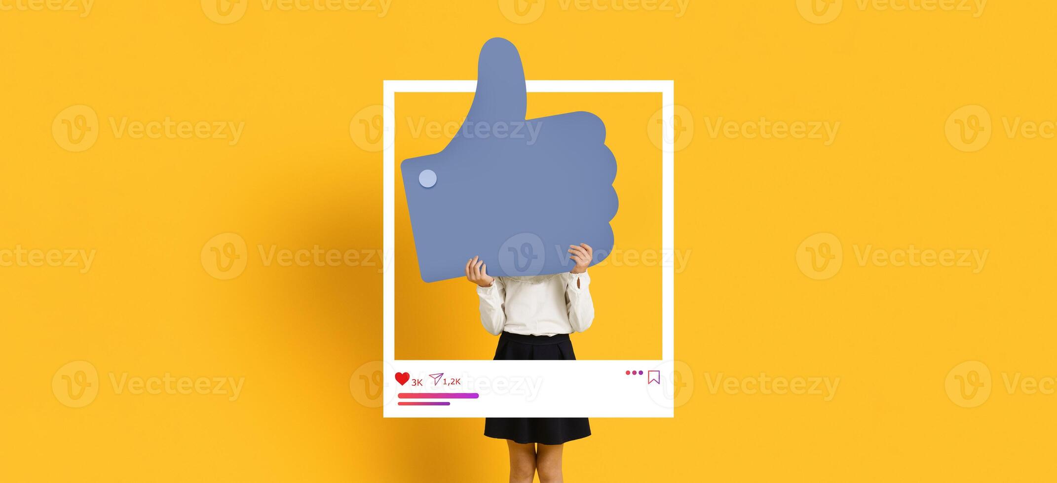 A person stands behind a large thumb up symbol, signifying approval and engagement on social media. photo