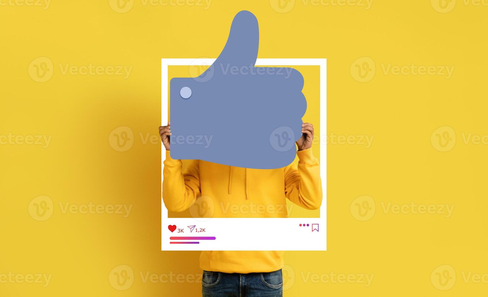 A social media influencer holds up a large thumbs-up symbol against a vibrant yellow background. They promote positivity and engagement in online content, encouraging their followers. photo