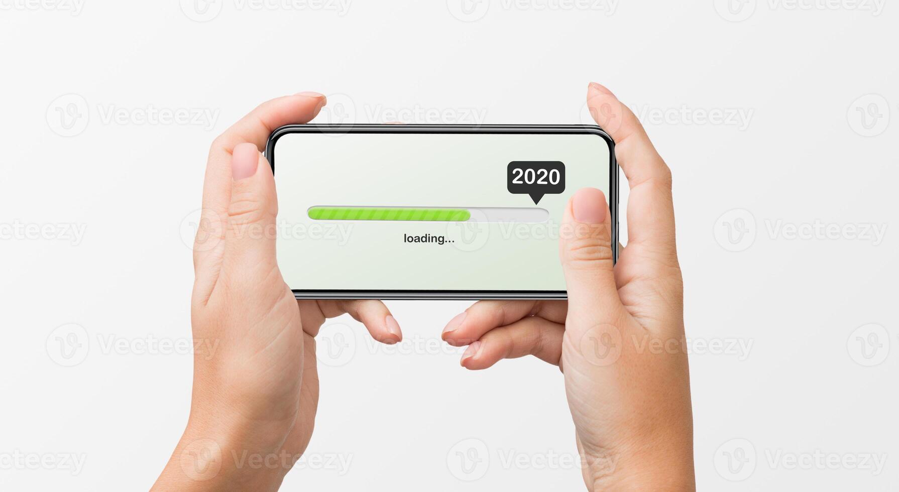 Woman's hands holding smartphone with 2020 number, loading progress bar on white background. 2020 coming soon concept photo