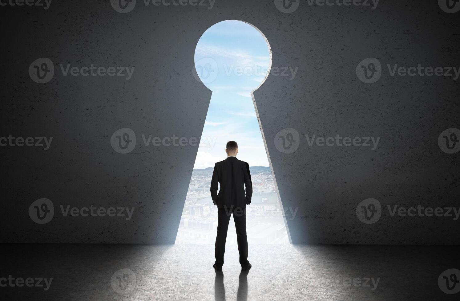 Silhouette of man against giant keyhole door. Access is allowed concept photo