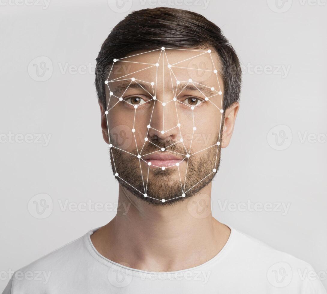 Personal safety concept. Caucasian man with face scanning grid on light background photo