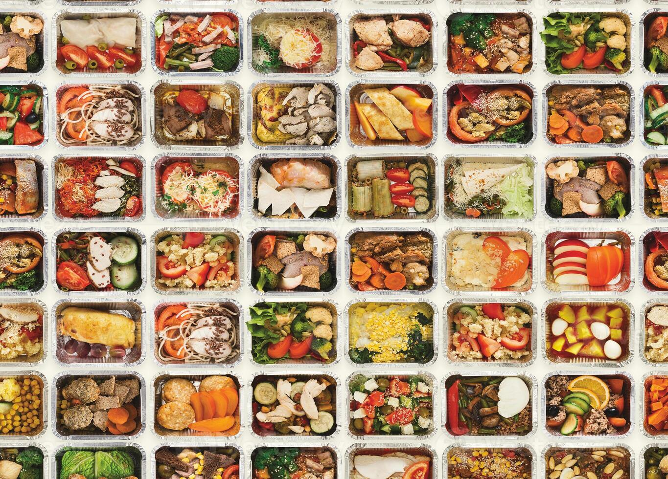 Collection of take away foil boxes with healthy food. Set of containers with everyday meals - meat, vegetables and law fat snacks on white background, top view, seamless photo