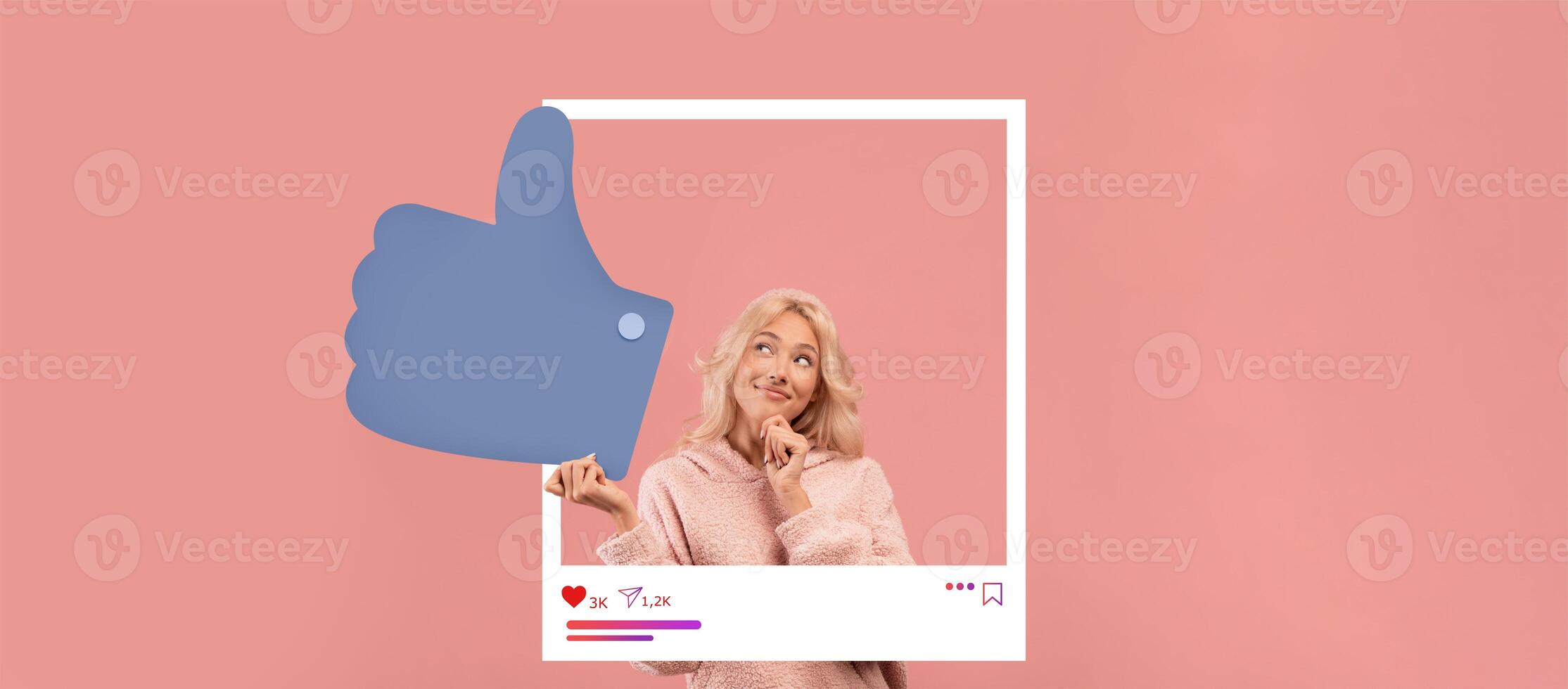 An influential content creator playfully poses with a thoughtful expression, giving a thumbs up. The warm, pink backdrop enhances the cheerful vibe of the social media atmosphere. photo