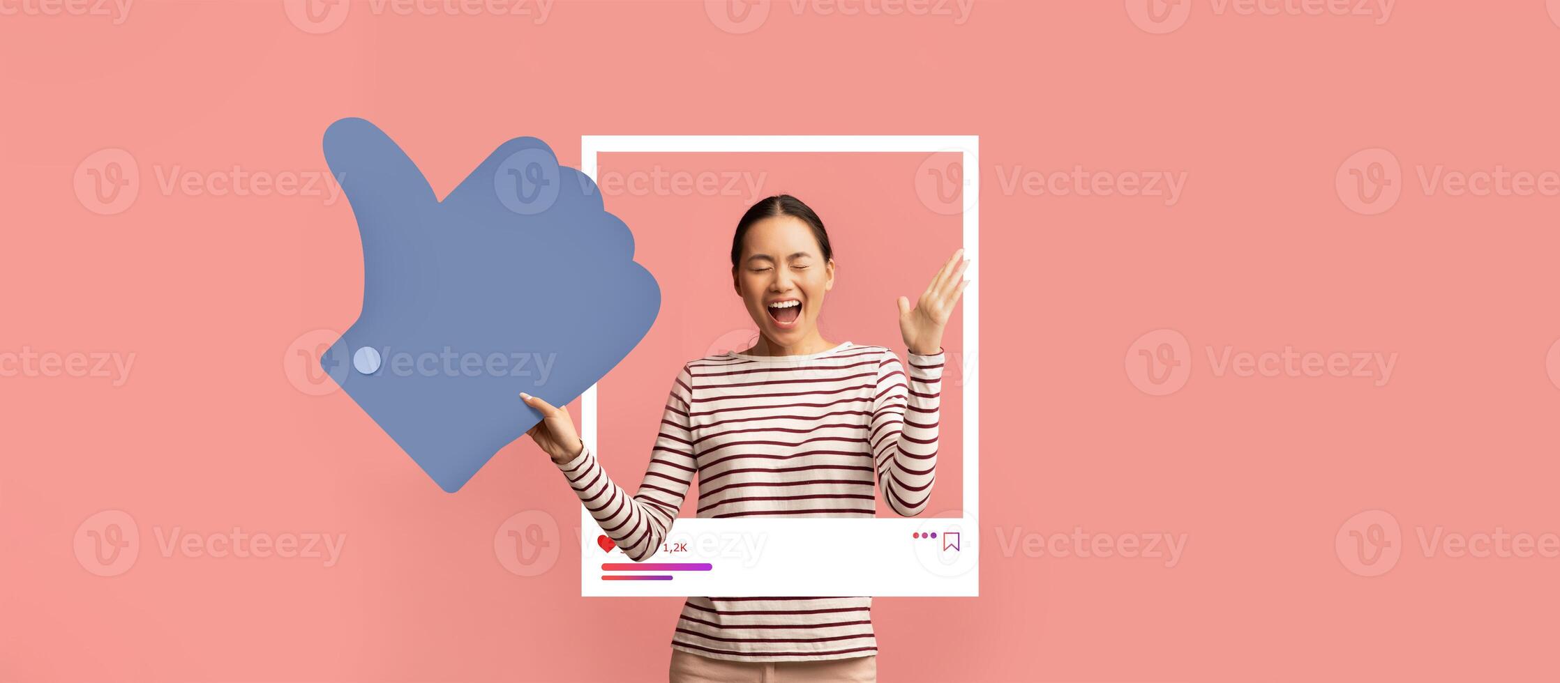 A cheerful individual enthusiastically poses with a thumbs up, embodying the spirit of social media engagement. photo