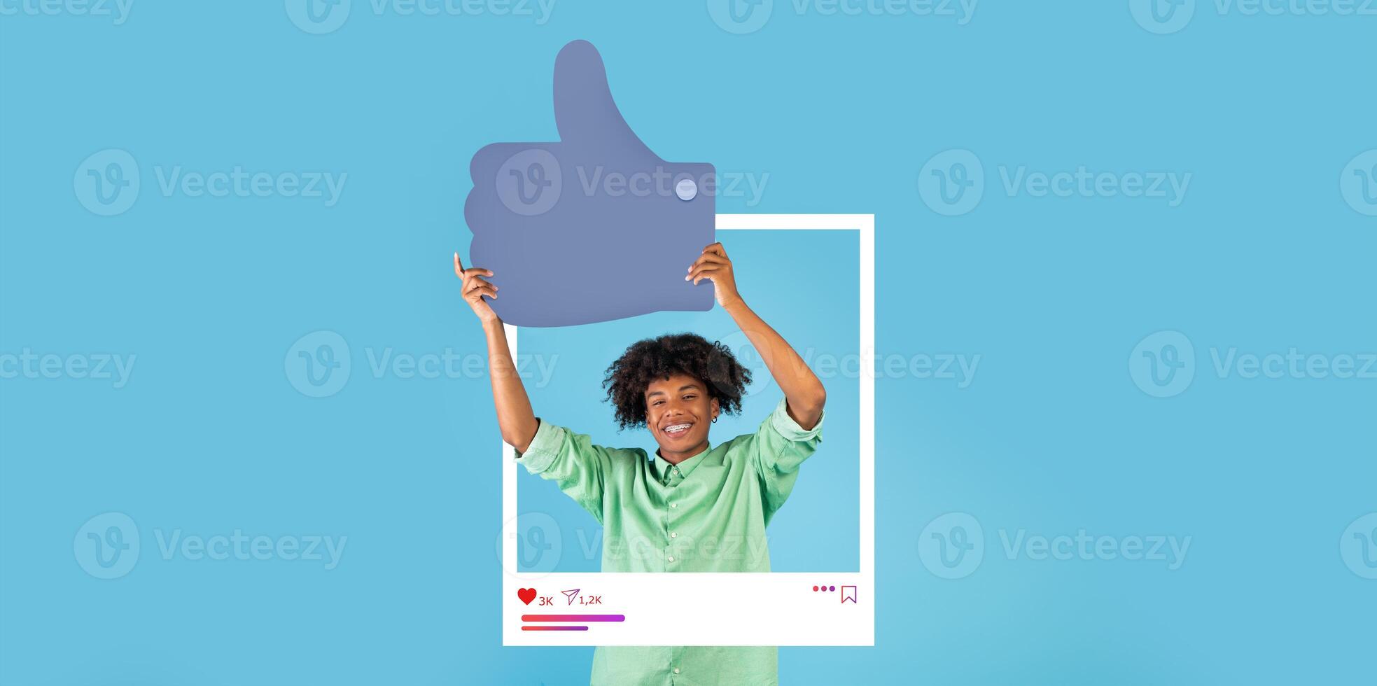 A cheerful individual holds a large thumbs up symbol, demonstrating approval and engagement. The background is bright blue, creating a lively atmosphere perfect for social media content. photo