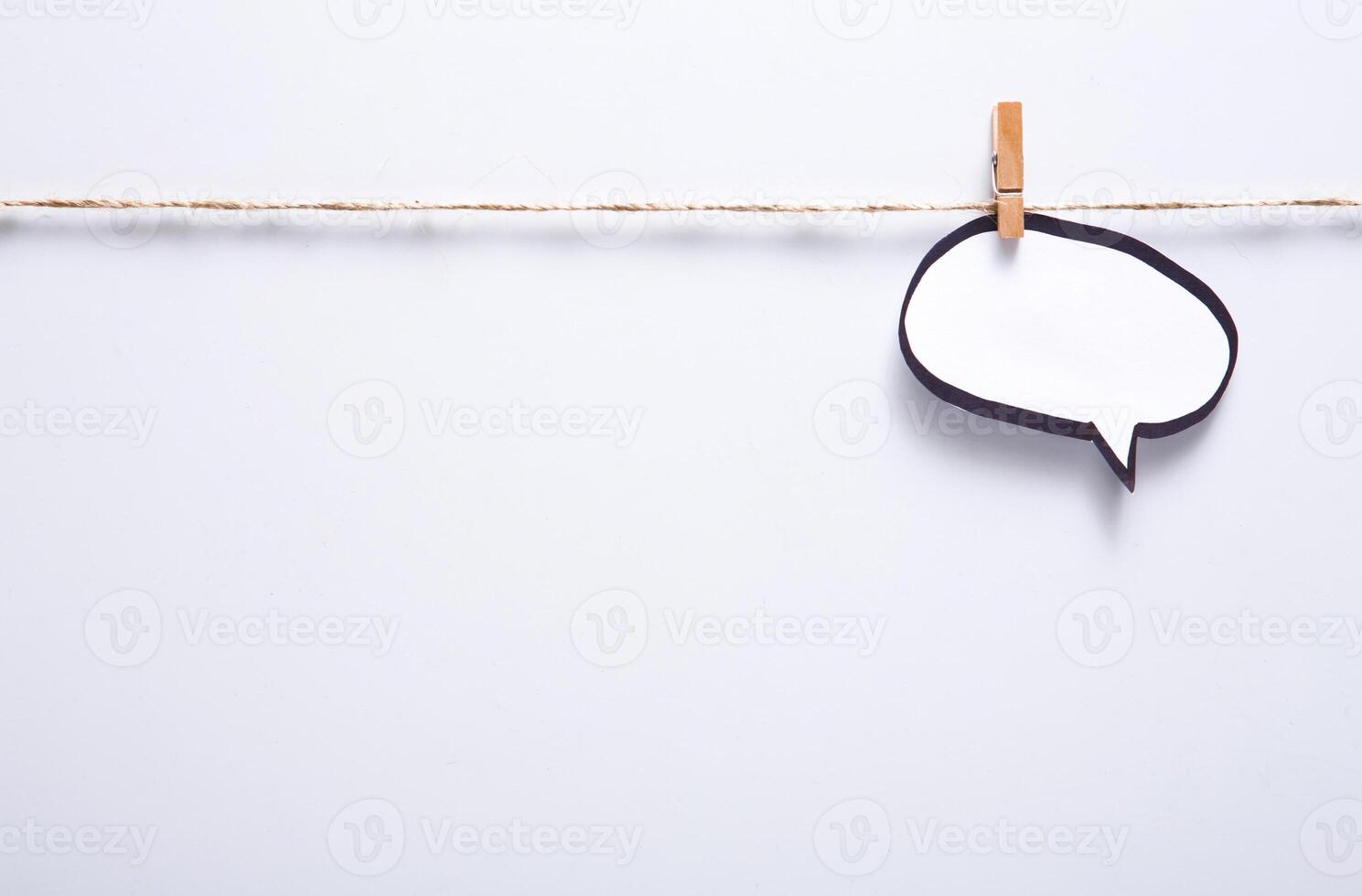 Creative ideas concept. Blank speech bubble hadcrafted on white background, top view, copy space for text photo