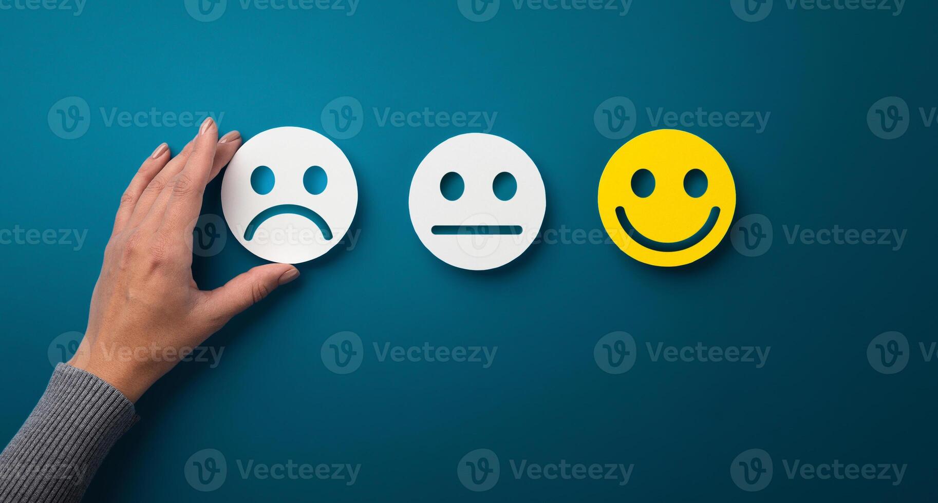 Rating concept. Woman choosing sad or bad smiley face emotion on green background, panorama, copy space photo